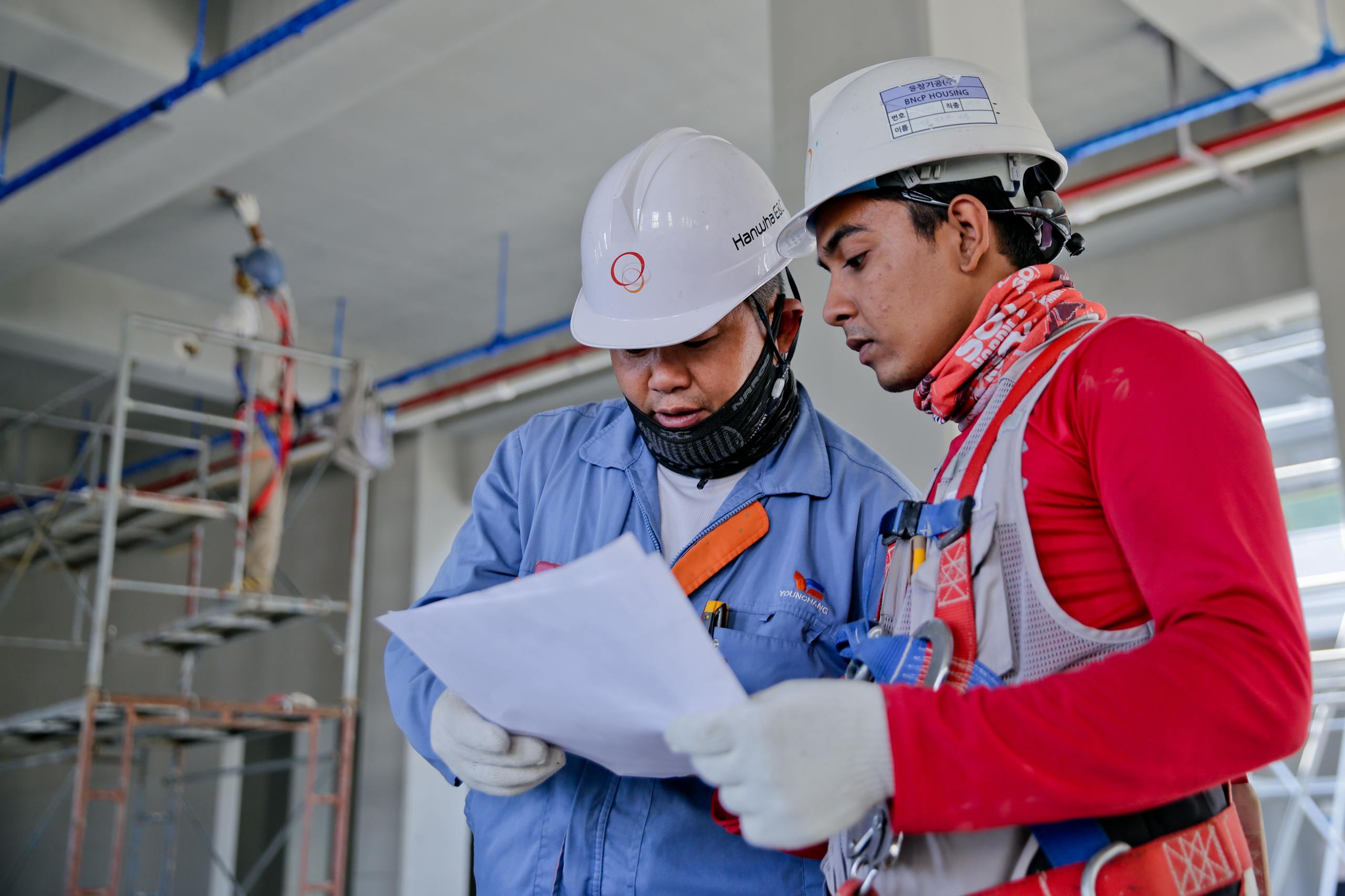 Engineers reviewing safety compliance at worksite