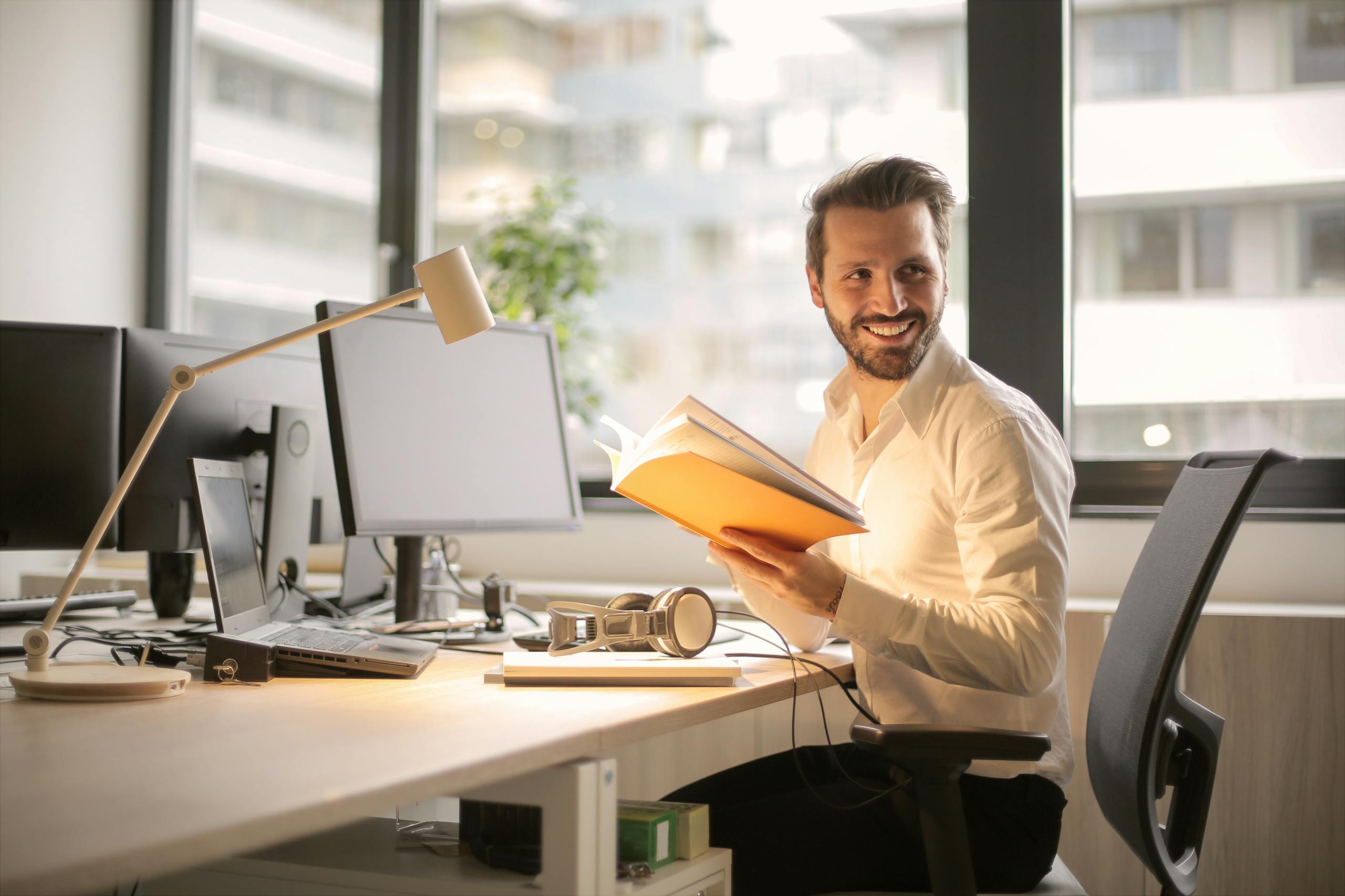 Founder relaxed at desk knowing HR is covered