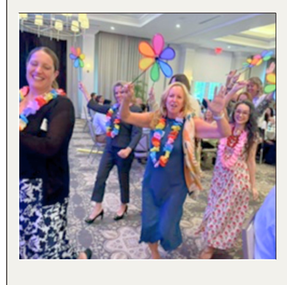 Catapult team members dancing with colorful flower pinwheels and leis at the 2026 Best Employers Gala.