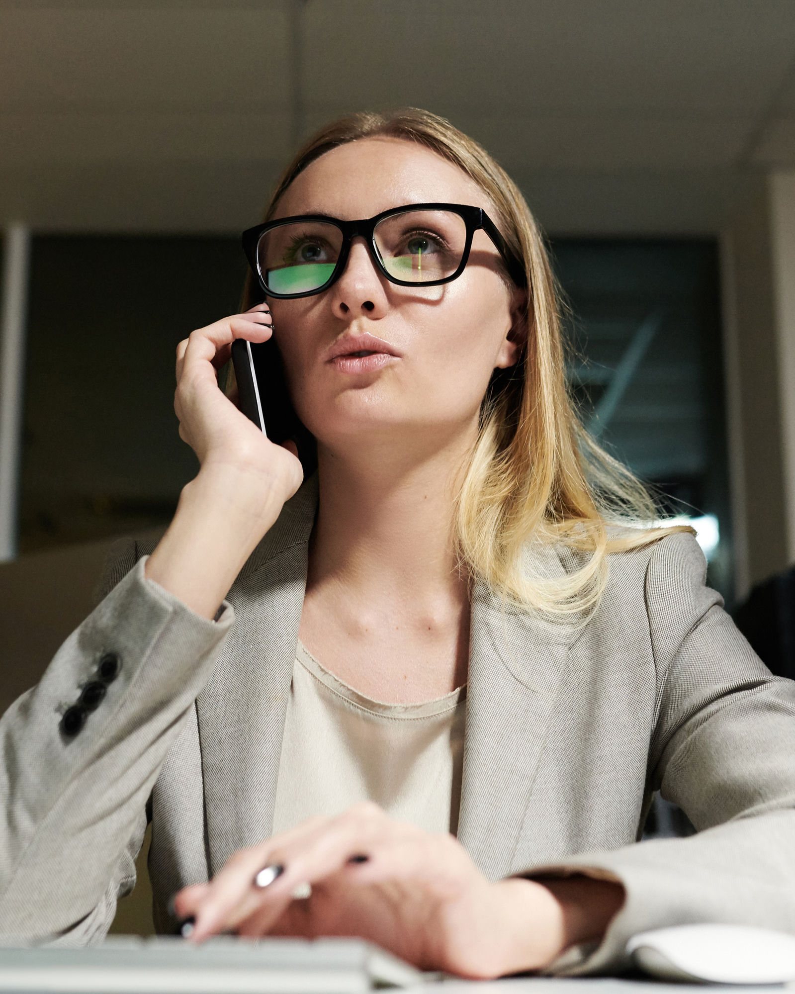 An HR manager taking an advice call at her desk