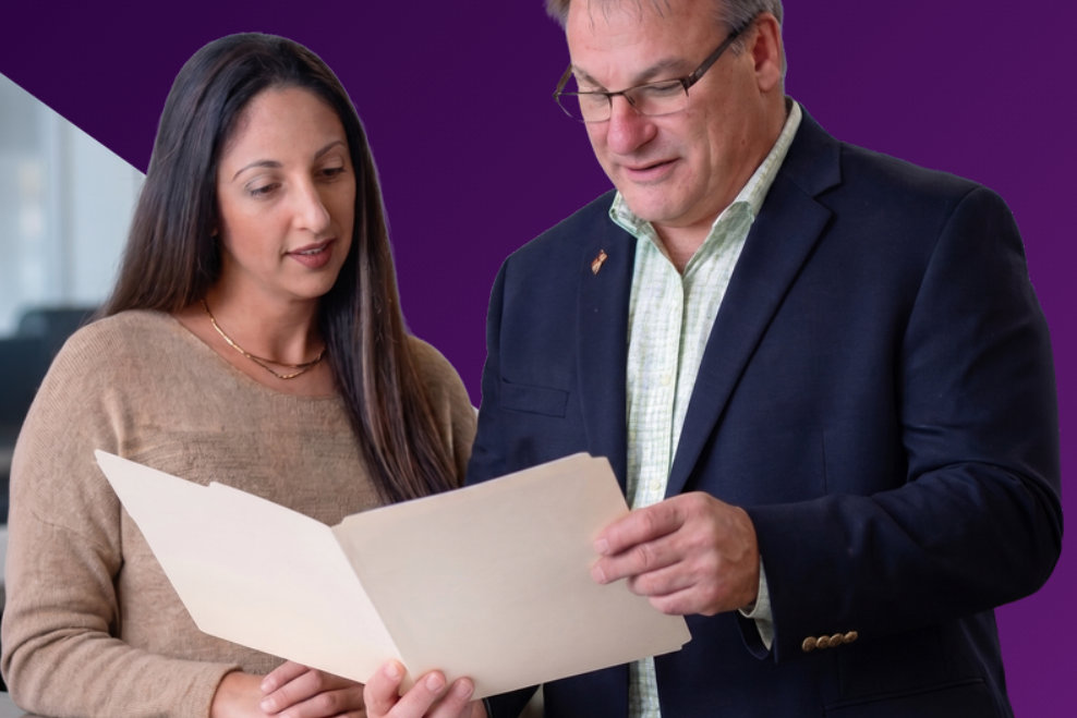 Two Catapult benefits specialists reviewing a COBRA claim file