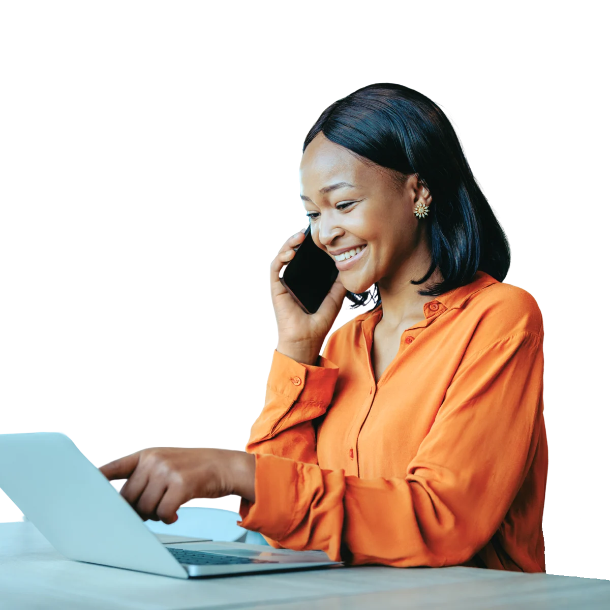 A smiling professional on a phone call at her laptop
