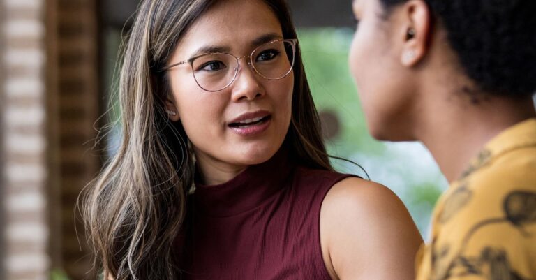 A manager talking with an employee across a table