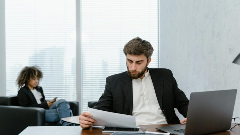 How to Measure Training ROI: Formula, Example and the Kirkpatrick Model 2 A manager reviews a training results report at his desk